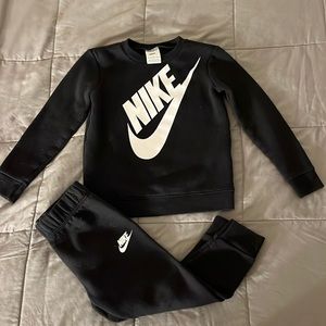 Black Nike sweatsuit.
